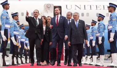 U.S. Vice President JD Vance, center, walks with Pakistan's Chief of Defence Forces and Chief of Army Staff Field Marshall Asim Munir, left, and Pakistani Deputy Prime Minister and Foreign Minister Mohammad Ishaq Dar after arriving for talks with Iranian officials in Islamabad, Pakistan, Saturday, April 11, 2026. (AP Photo/Jacquelyn Martin, Pool)