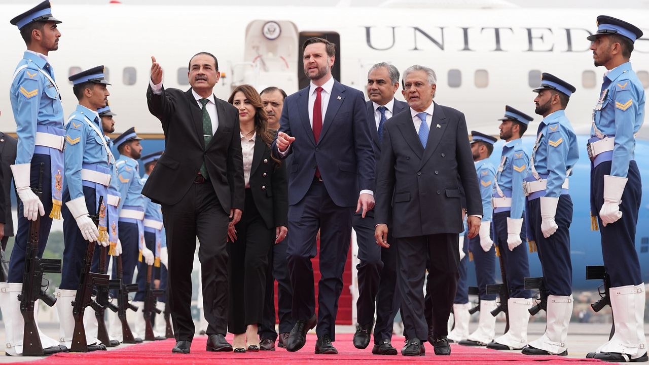 U.S. Vice President JD Vance, center, walks with Pakistan's Chief of Defence Forces and Chief of Army Staff Field Marshall Asim Munir, left, and Pakistani Deputy Prime Minister and Foreign Minister Mohammad Ishaq Dar after arriving for talks with Iranian officials in Islamabad, Pakistan, Saturday, April 11, 2026. (AP Photo/Jacquelyn Martin, Pool)