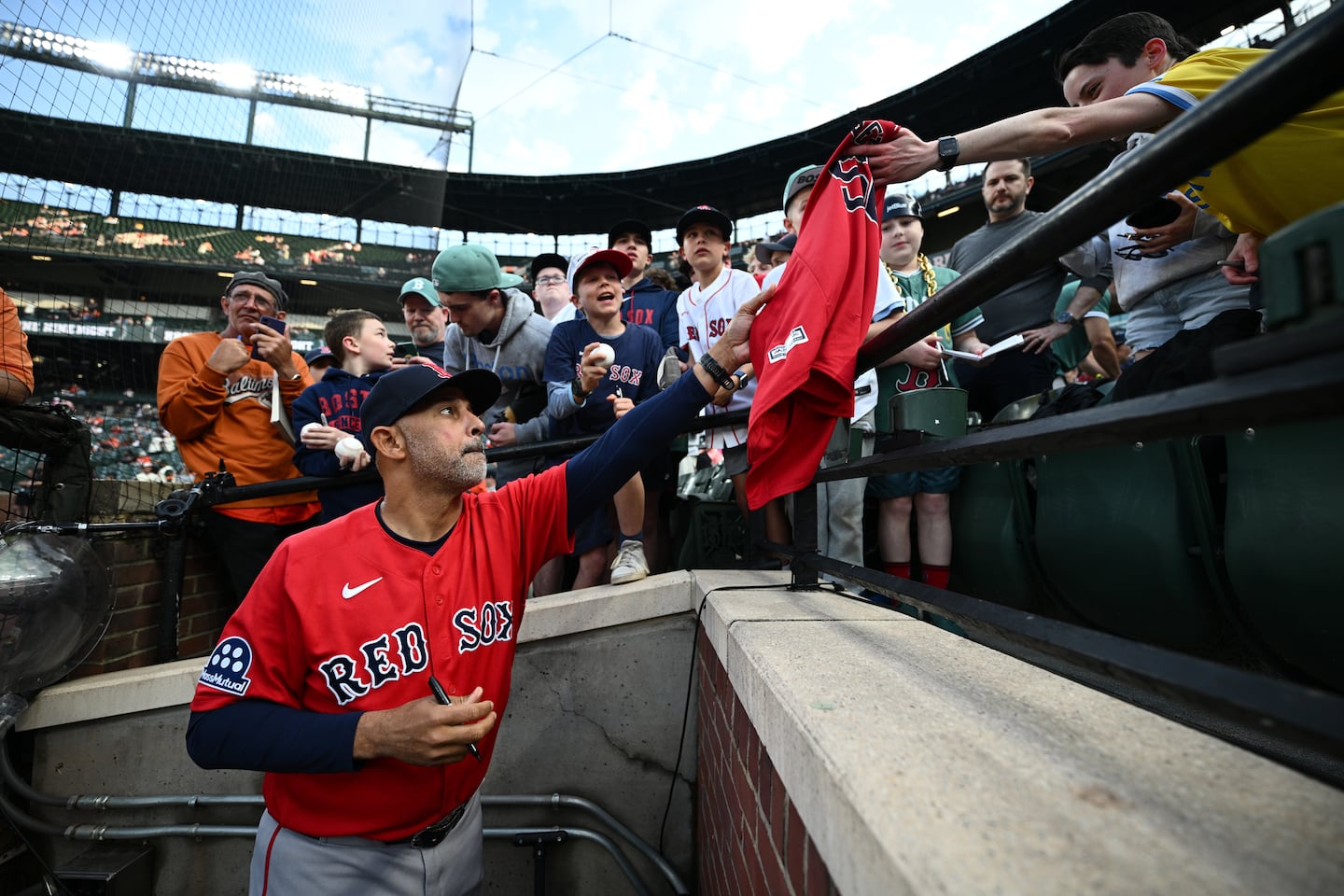 Alex Cora signed for fans at Camden Yards during his last weekend as Red Sox manager.