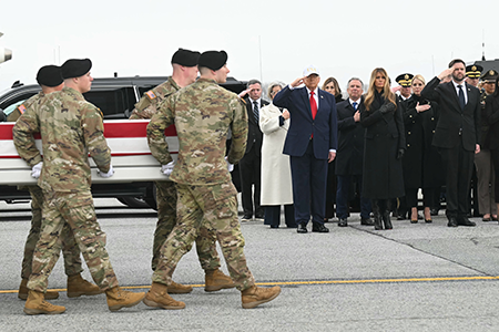 U.S. President Donald Trump, special envoy Steve Witkoff, and First Lady Melania Trump are among administration officials witnessing a dignified transfer ceremony March 7 at Dover Air Force Base. The flag-draped casket contained the remains of Sgt. 1st Class Nicole M. Amor, who was killed in the Iran war. (Photo by Saul Loeb/AFP via Getty Images)