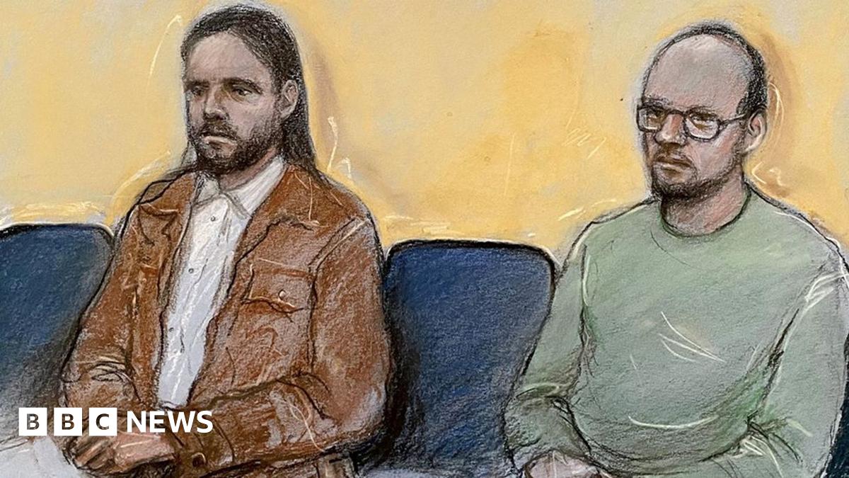 Court artist drawing of Jamie Varley (left) sitting in the dock at Preston Crown Court with long dark hair and a beard wearing a white shirt and brown jacket with co-accused John McGowan-Fazakerley who is nearly bald with a short dark beard and glasses and a green sweatshirt