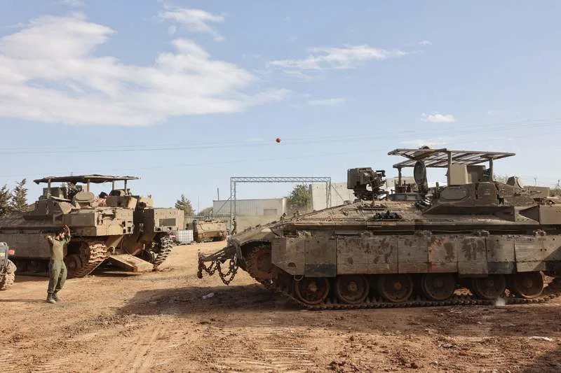 Israeli troops seen at a staging area in northern Israel near the border with Lebanon. Gil Cohen Magen/dpa