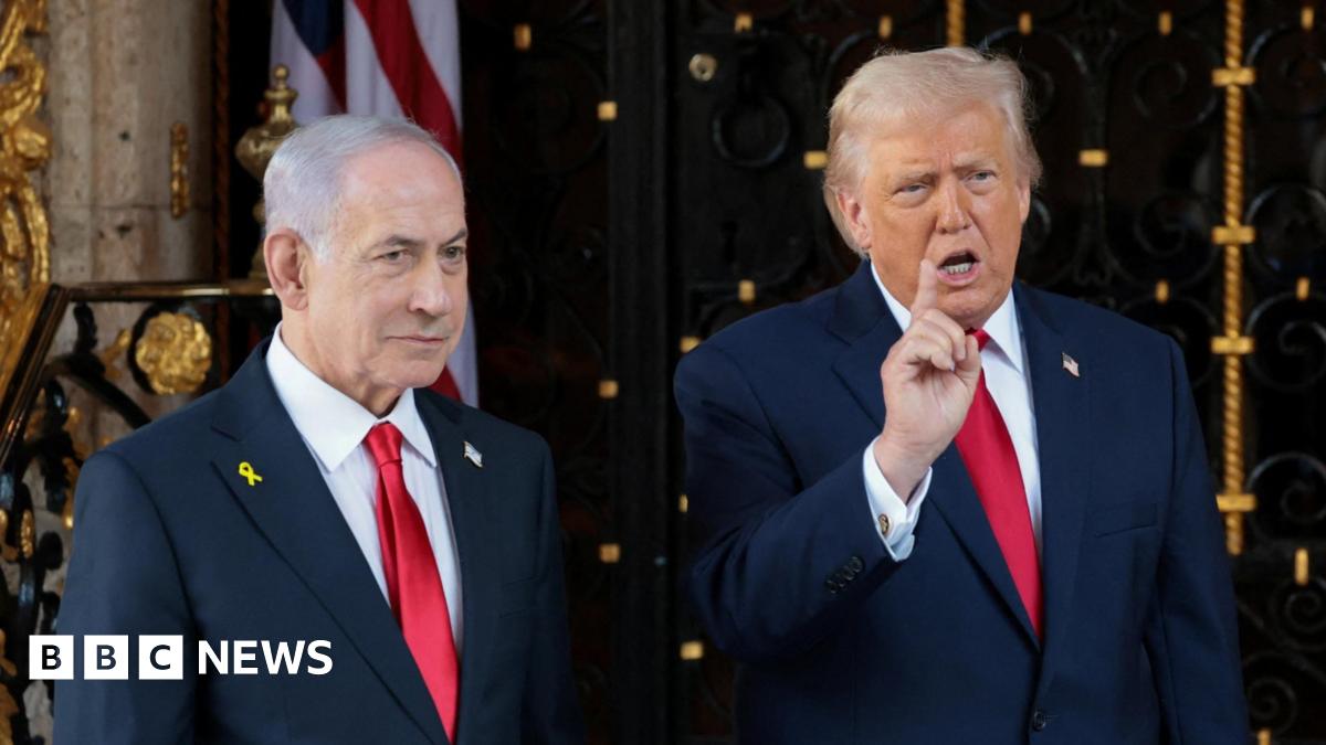 U.S. President Donald Trump speaks to the media next to Israeli Prime Minister Benjamin Netanyahu.