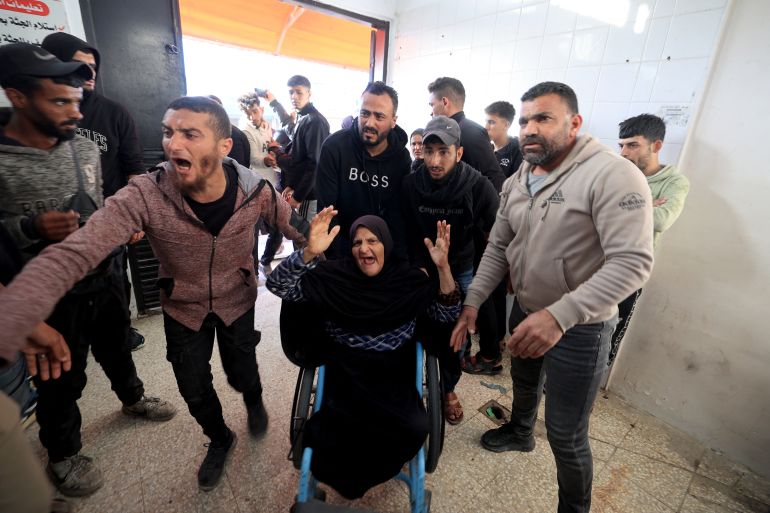 Family members arrive at the Al-Aqsa Martyrs Hospital in Deir al-Balah, where victims have been brought following an Israeli strike on the Al-Maghazi refugee camp in the central Gaza Strip on April 6, 2026.