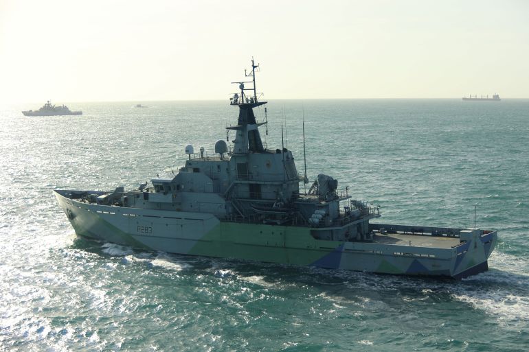 This undated handout image release on April 9, 2026 by Britain's Royal Navy shows the HMS Mersey (foreground) tracking Russian frigate Admiral Grigorovich (far L) and Kilo-class submarine Krasnodar (2nd L-in distance) in UK waters at sea.