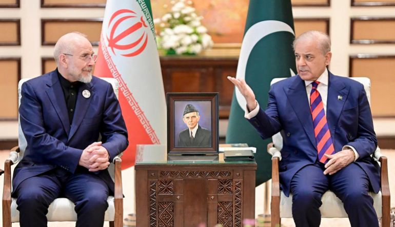 This handout photograph taken on April 11, 2026 and released by Pakistan's Prime Minister Office shows Pakistan's Prime Minister Shehbaz Sharif (R) speaking with Iran's parliamentary speaker Mohammad Bagher Ghalibaf during their meeting prior to the US-Iran peace talks in Islamabad.