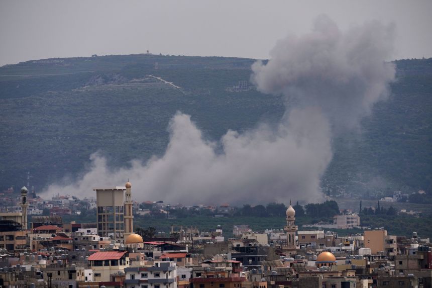 Smoke rises following an Israeli airstrike on the village of Qlaileh, as seen from the southern port city of Tyre, Lebanon, Wednesday, April 15, 2026. (AP Photo/Hussein Malla)
