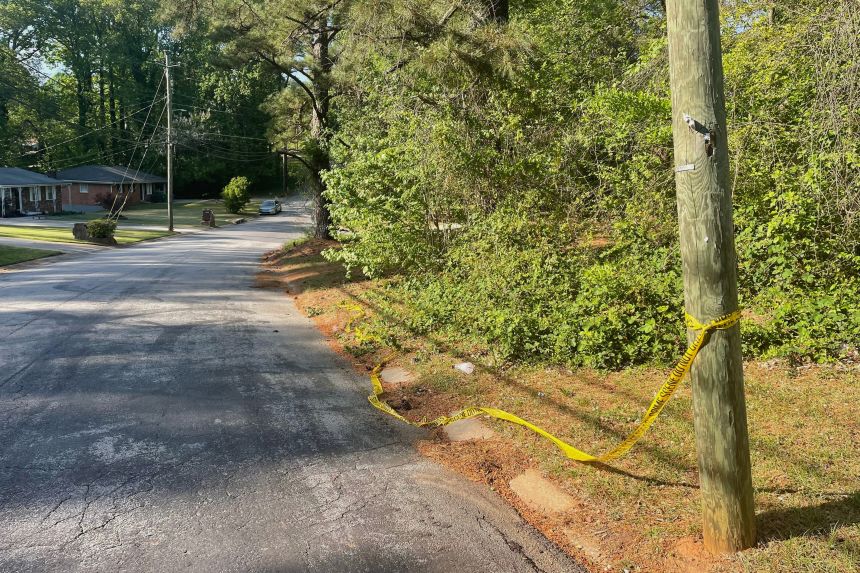 Crime scene tape is tied around a pole near the site where Lauren Bullis was killed in Panthersville, Georgia, on Wednesday.