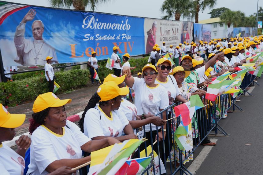 Catholic faithful wait for the arrival of Pope Leo XIV at the airport in Malabo, Equatorial Guinea, on Tuesday, April 21, 2026.