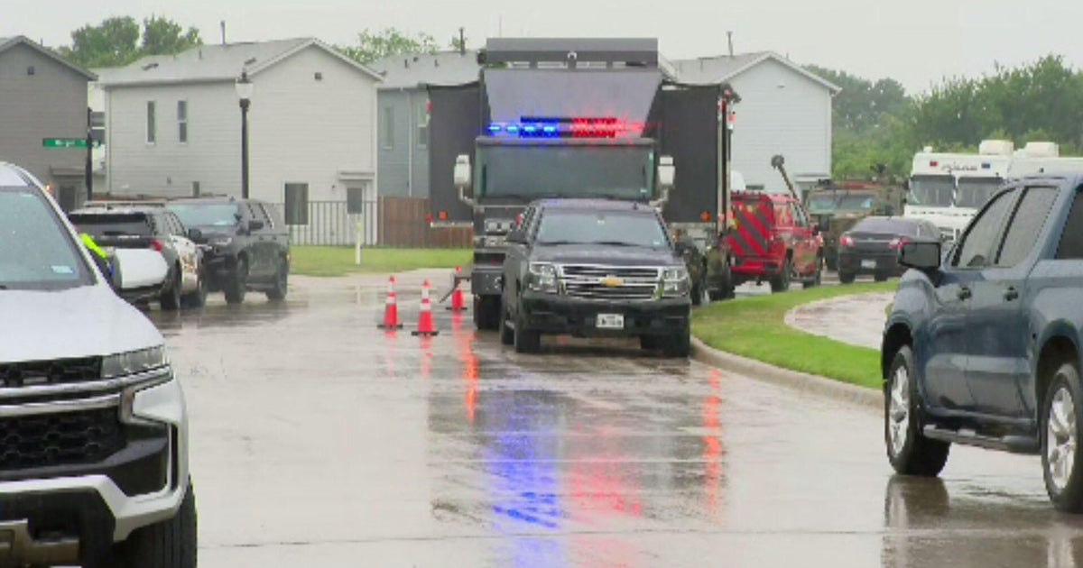Woman rescued, suspect in custody after day-long standoff at North Texas home, police say