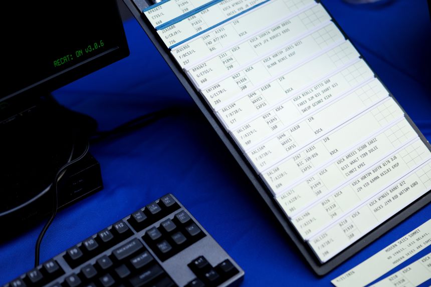 Paper flight strips are seen during a news briefing at the Department of Transportation on Tuesday, April 21.