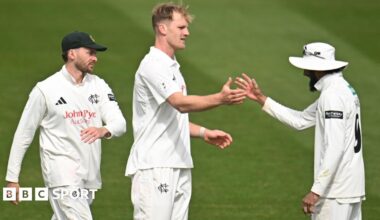 Dillon Pennington (centre) is congratulated by captain Haseeb Hameed (right, wearing a white floppy hat) as another Notts fielder (left) comes towards them