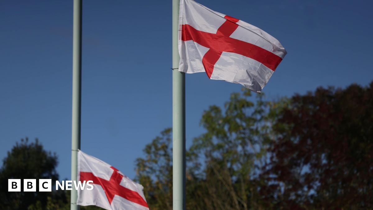 Flags of St George fly on lamp posts in London.