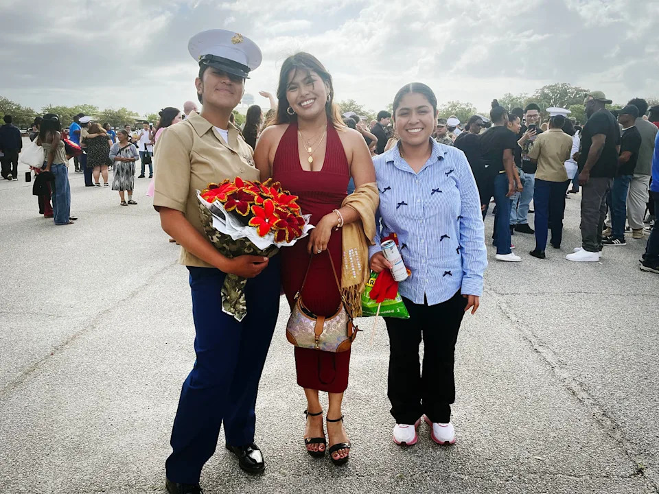 U.S. Marines graduate Pvt. Ramirez Garcia, her wife and her sister, right, Emily Ramirez pose after the graduation. (Suzanne Gamboa / NBC News)