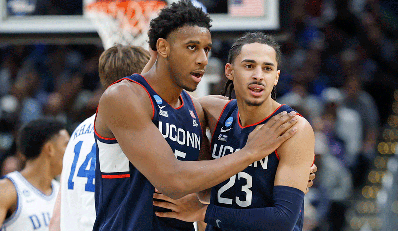Tarris Reed Jr. (5) and UConn Huskies forward Jayden Ross (23) celebrate after a play against the Duke Blue Devils.