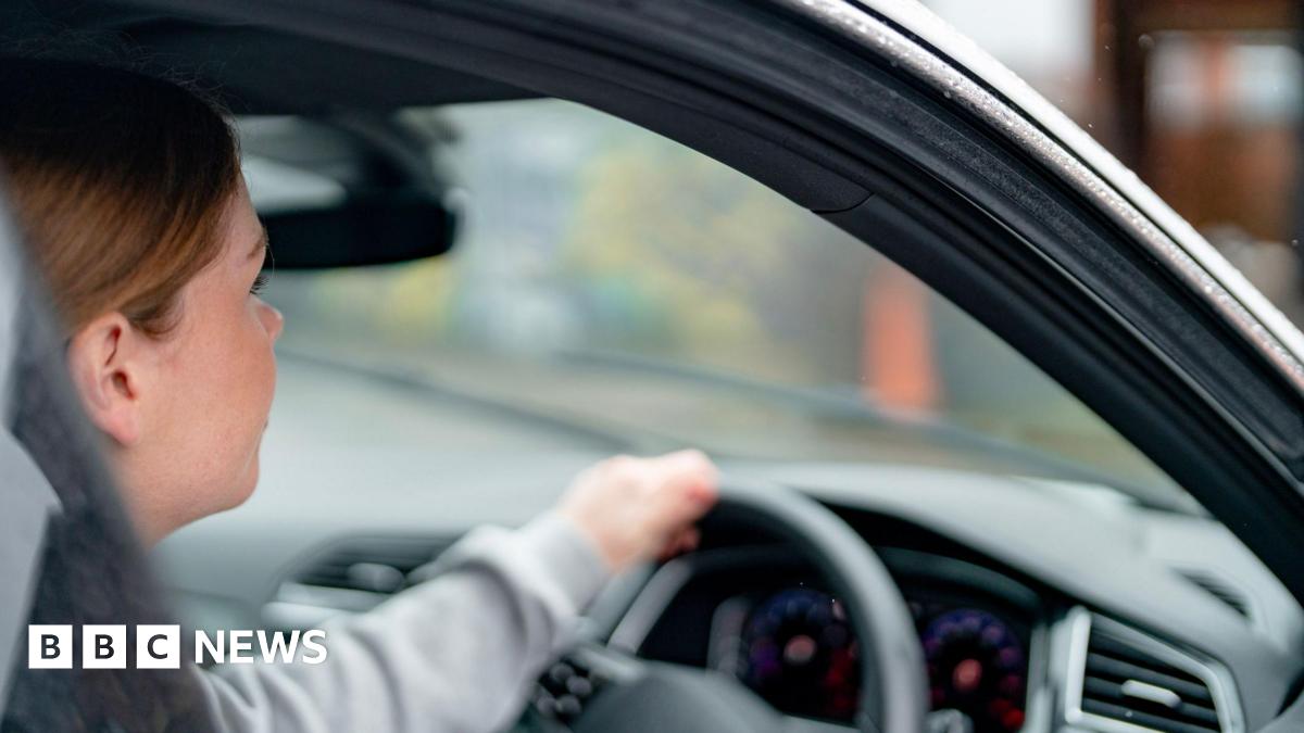 Driver behind the wheel of a car