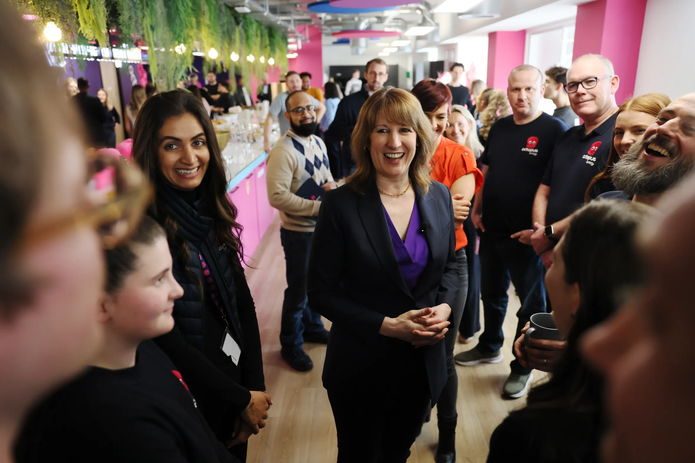 UK Chancellor Rachel Reeves speaking with staff at Octopus Energy offices.