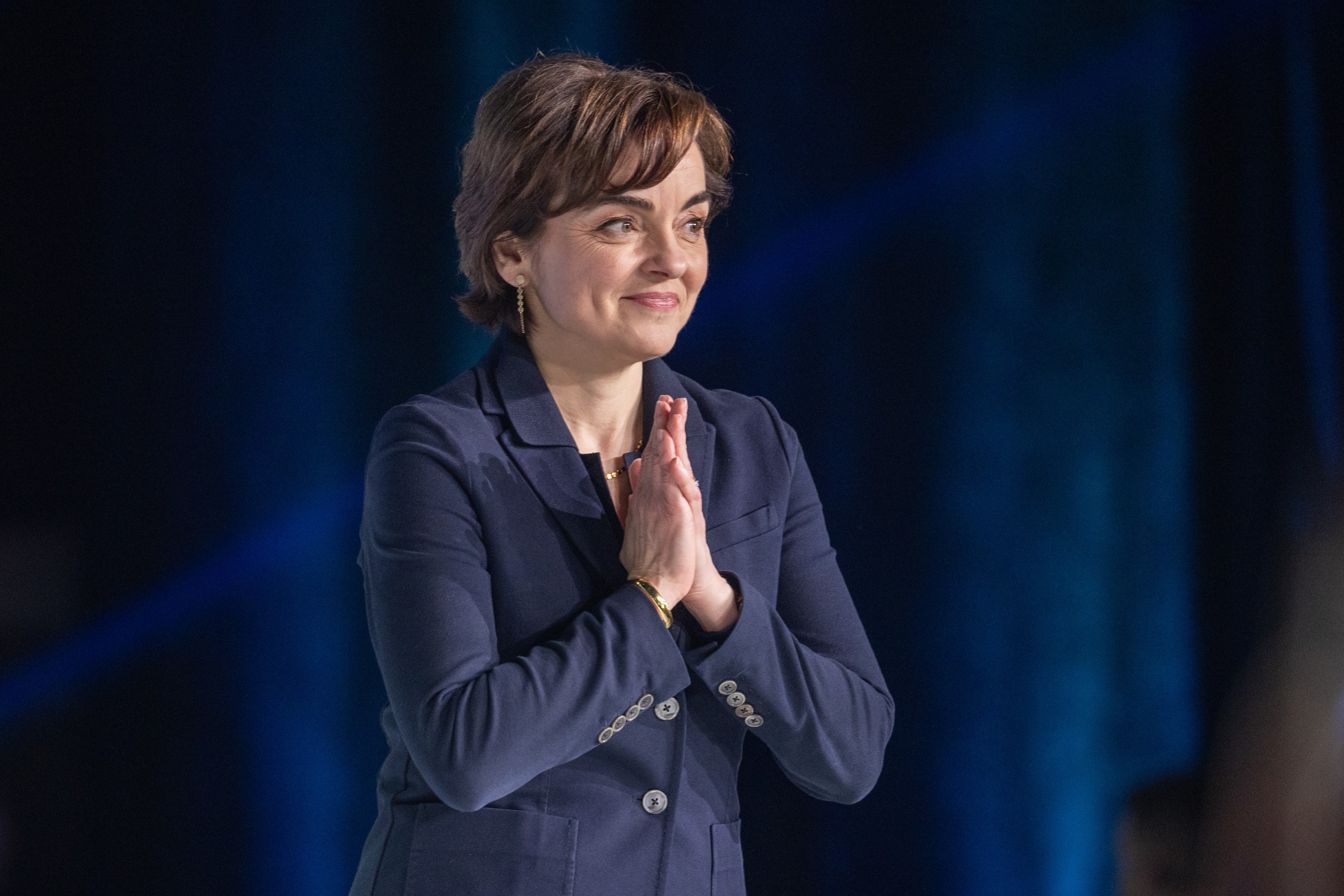 Christine Fréchette clasps her hands as she prepares to speak at a Coalition Avenir Québec convention.