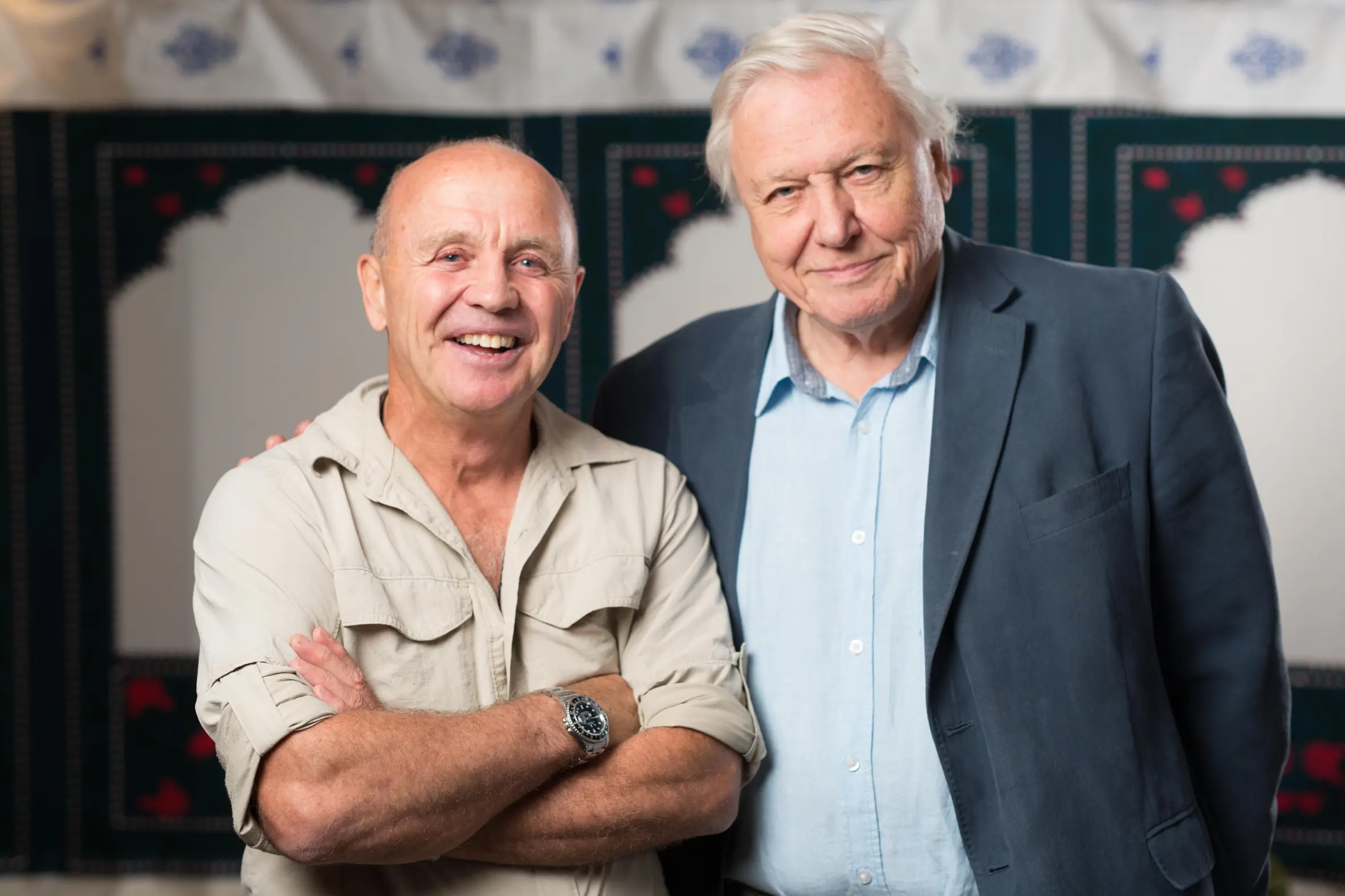 David Attenborough and a man, possibly a festival organizer, smiling at the Radio Times Festival.