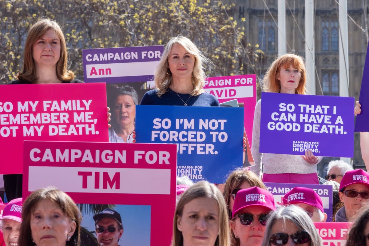 Four terminally ill women stood on plinths to call on MPs to act on their democratic mandate and bring back the Assisted Dying for Terminally Ill Adults Bill in the next parliament (PA)