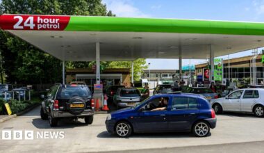 Vehicles waiting to fill up their vehicles at a petrol station in Yeovil, Somerset UK.