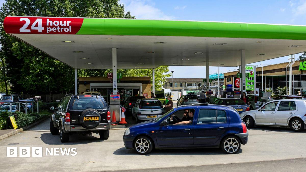 Vehicles waiting to fill up their vehicles at a petrol station in Yeovil, Somerset UK.