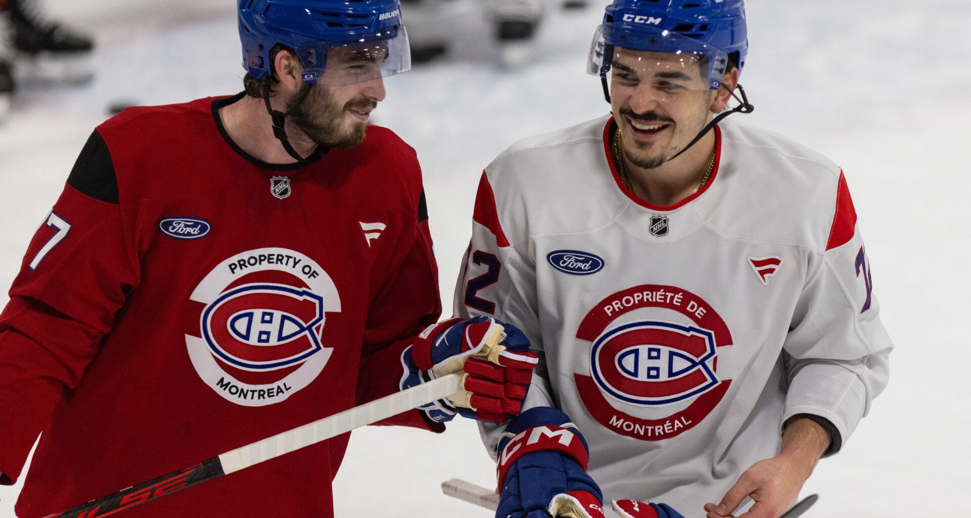 Canadiens forward Kirby Dach, left, and defenceman Arber Xhekaj during a light moment at the end of practice in Brossard on Thursday.