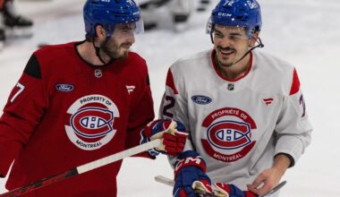 Canadiens forward Kirby Dach, left, and defenceman Arber Xhekaj during a light moment at the end of practice in Brossard on Thursday.
