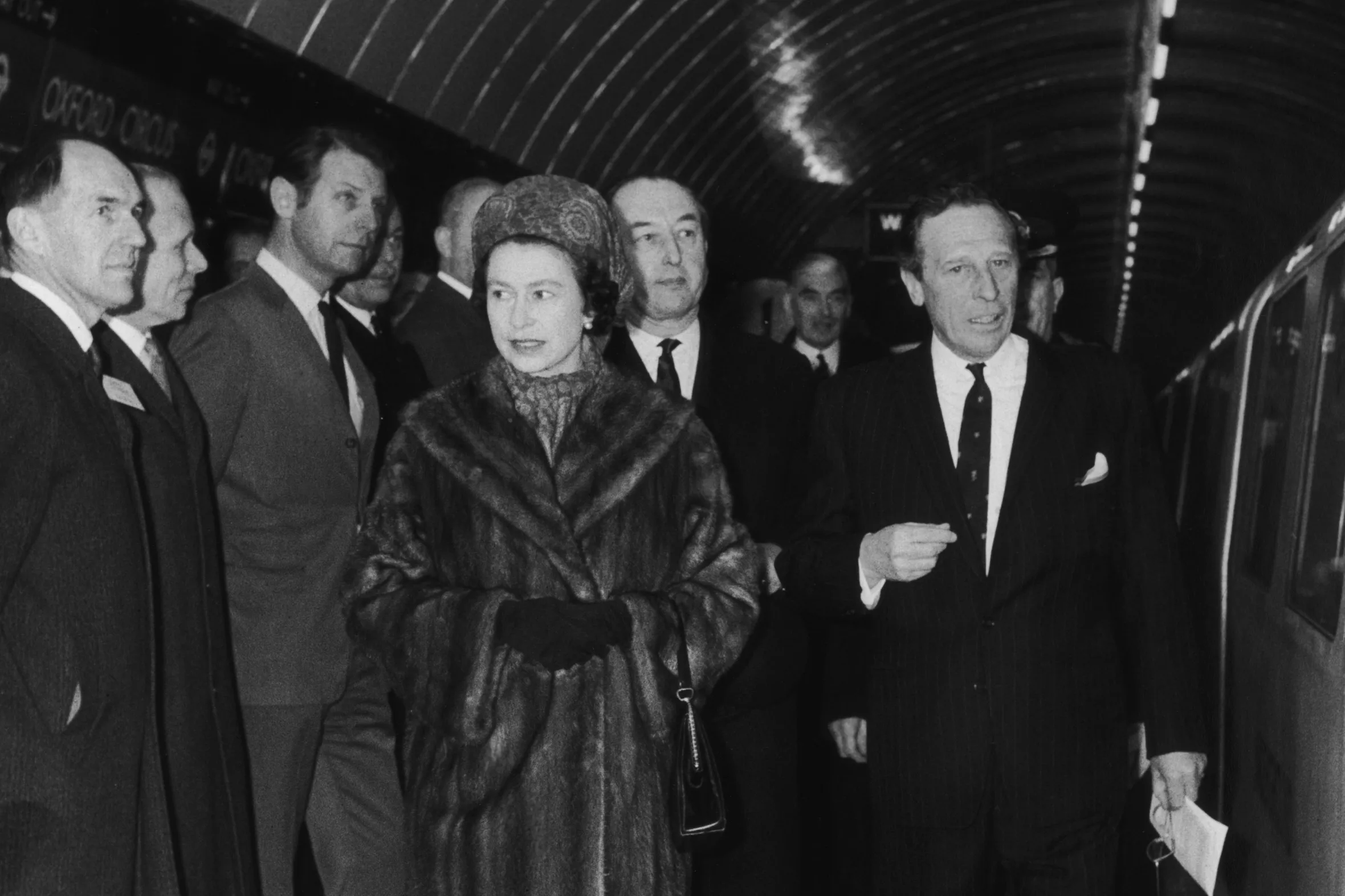 Queen Elizabeth II on a subway platform during the opening of the new Victoria Line.