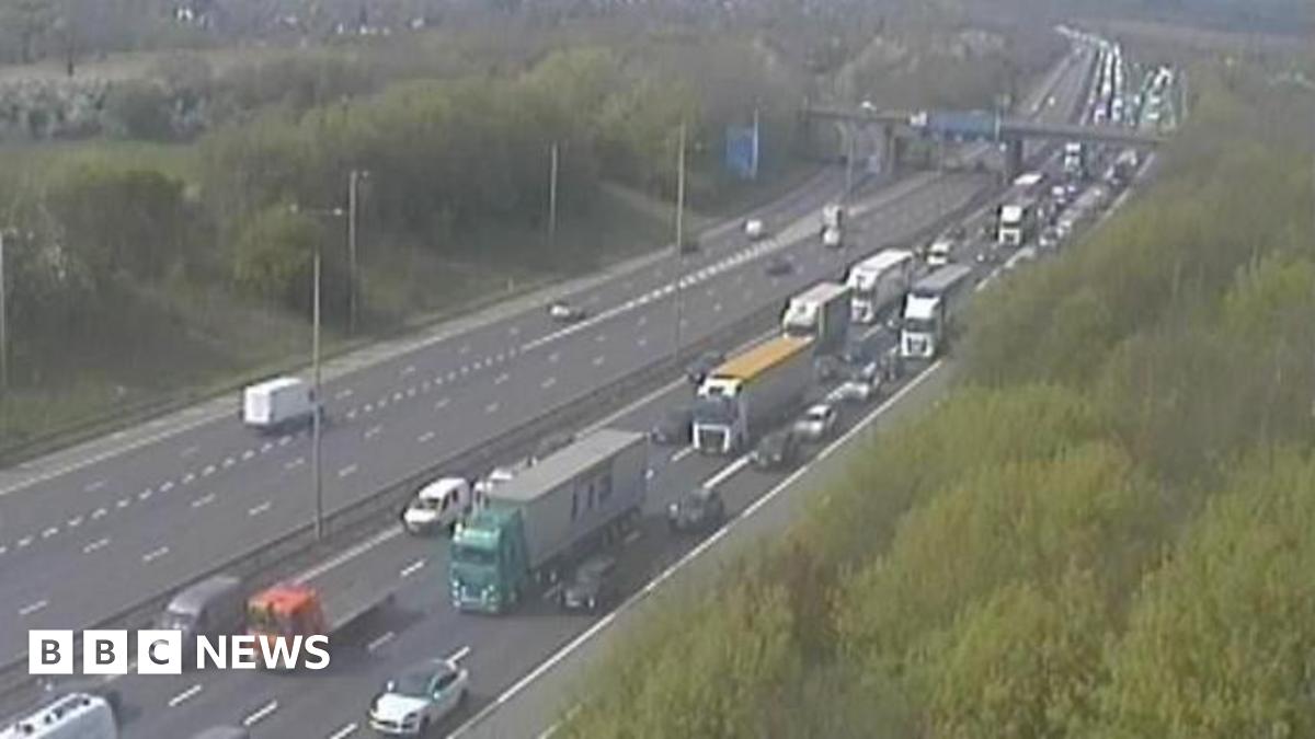 M1 Junction 20 is pictured, with queueing traffic on one side of the road