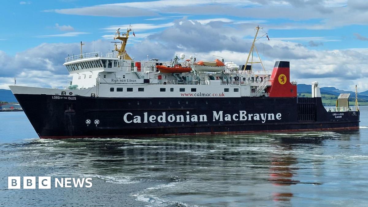 A black and white ship with red funnels. Caledonian MacBrayne is written on the side. There are blue skies and clouds in the background