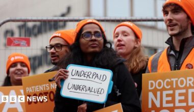 Striking resident doctors outside St Thomas' Hospital in London in December 2025