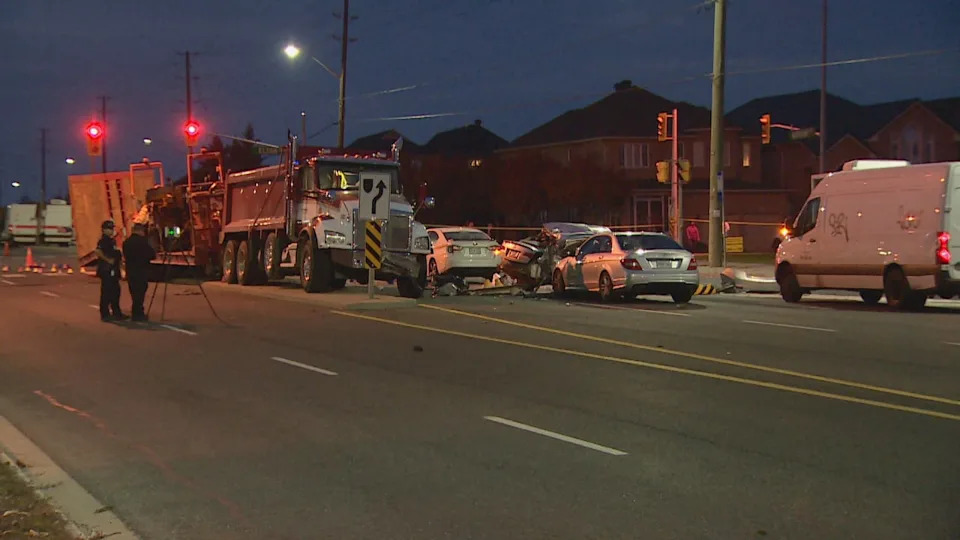 York Regional Police are shown here investigating the crash in Markham that led to the deaths of three members of the same family. (Keith Burgess/CBC)