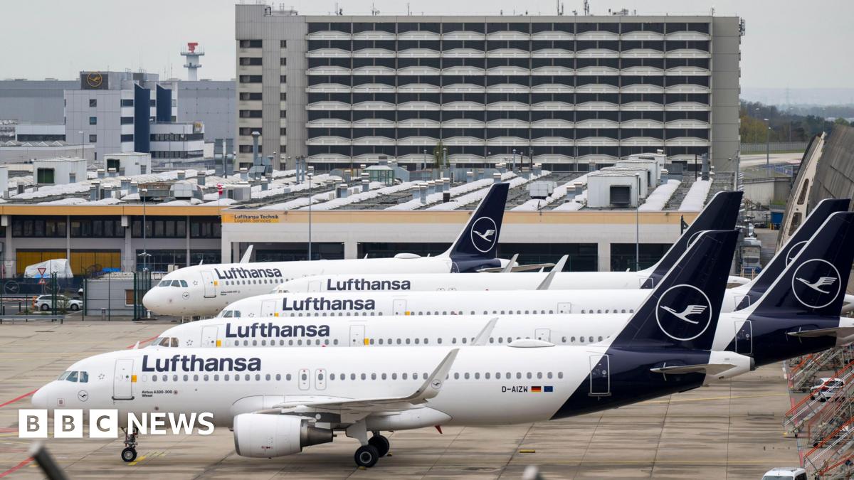 Parked Lufthansa aircraft are lined up at Frankfurt Airport on April 13, 2026.