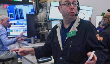 Asian shares are mixed and oil gains more than $1 as Iran talks remain in flux