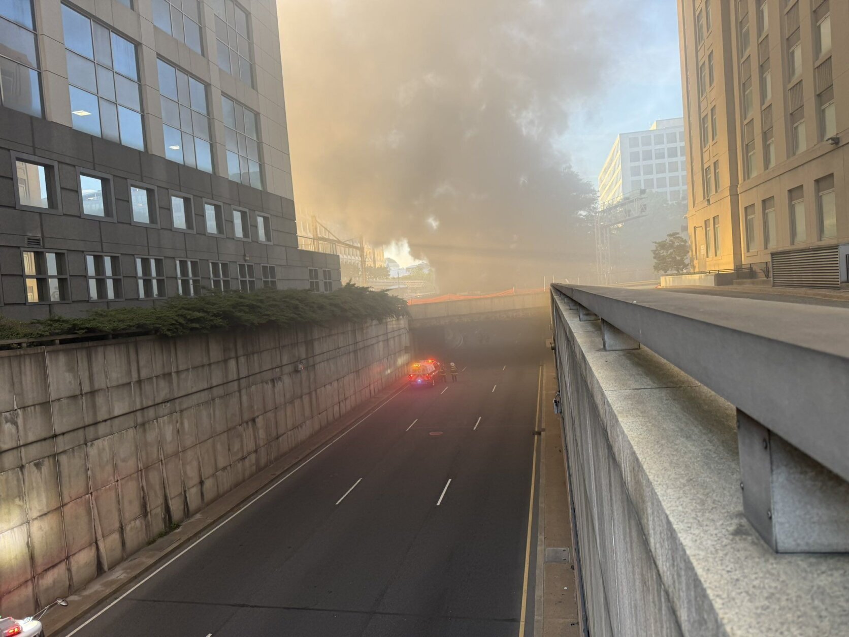 smoke fills the sky in city