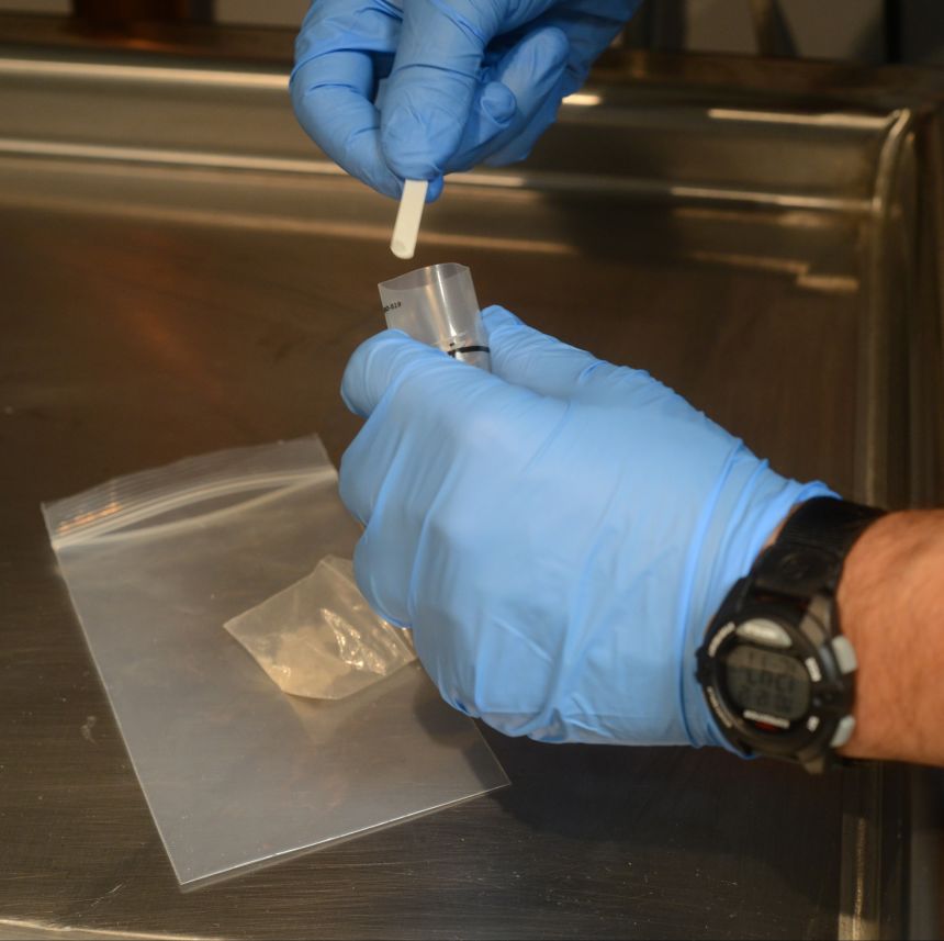 An officer in Pennsylvania tests material for the possible presence of methamphetamine.