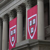 Harvard banners hang in front of Widener Library during the 374th Harvard Commencement in Harvard Yard in Cambridge, Massachusetts.