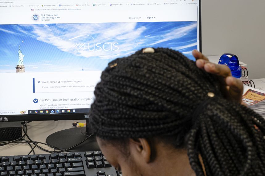 A Haitian immigrant logs in to the US Citizenship and Immigration Services website at St. Vincent de Paul Society in Springfield, Ohio, in February.