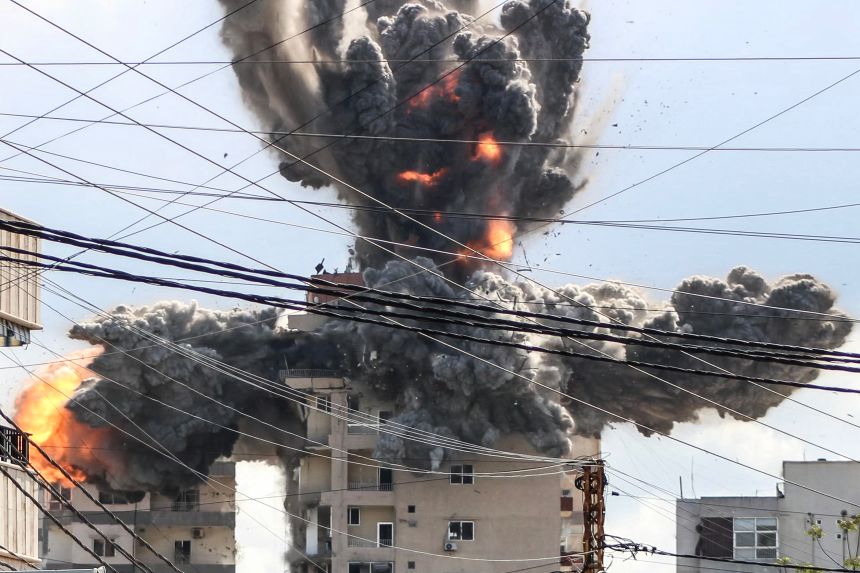 A fireball rises from a building hit by an Israeli airstrike in the area of Abbasiyeh, on the outskirts of the southern Lebanese city of Tyre, on April 8, 2026.