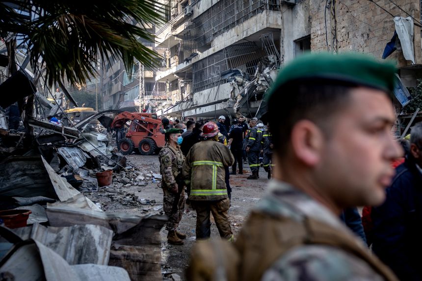 Emergency services clear rubble after an Israeli airstrike in Beirut