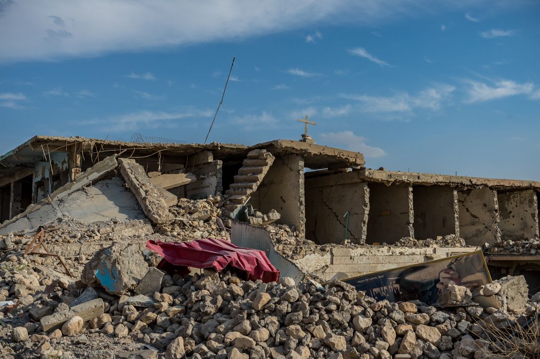 A cross remains above the ruins of Sinjar, Iraq, after attacks by ISIS in October 2016.