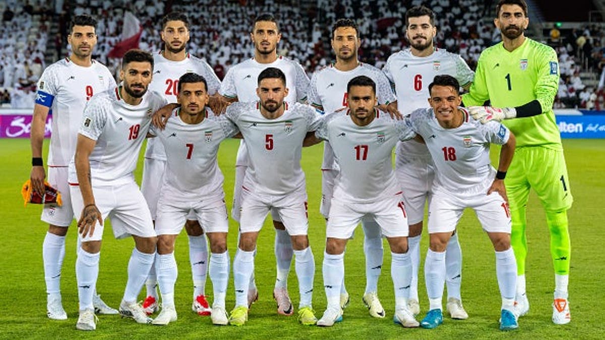 Iran team players posing for a team photo at Jassim Bin Hamad Stadium in Doha