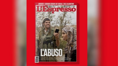 The cover image of the Italian magazine, dated April 10, 2026, shows an armed Israeli settler filming a Palestinian woman during a raid in the occupied West Bank. (L'Espresso/X)