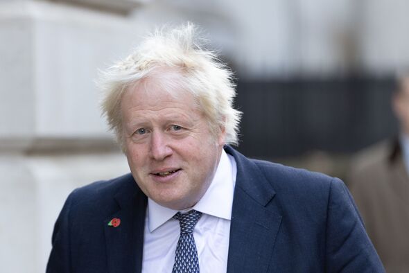 Former Prime Minister of the UK Boris Johnson walks through Former Prime Minister of the UK Boris Johnson walks through
