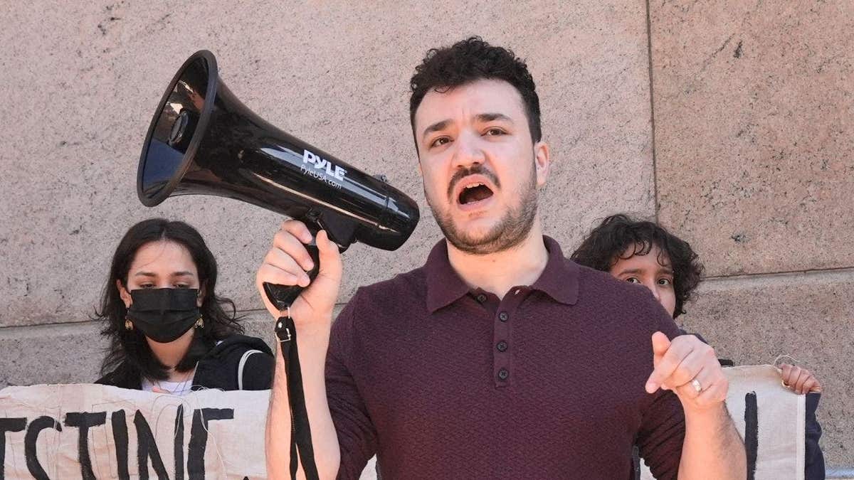 Mahmoud Khalil speaks into a megaphone at a protest outside Columbia University in New York City