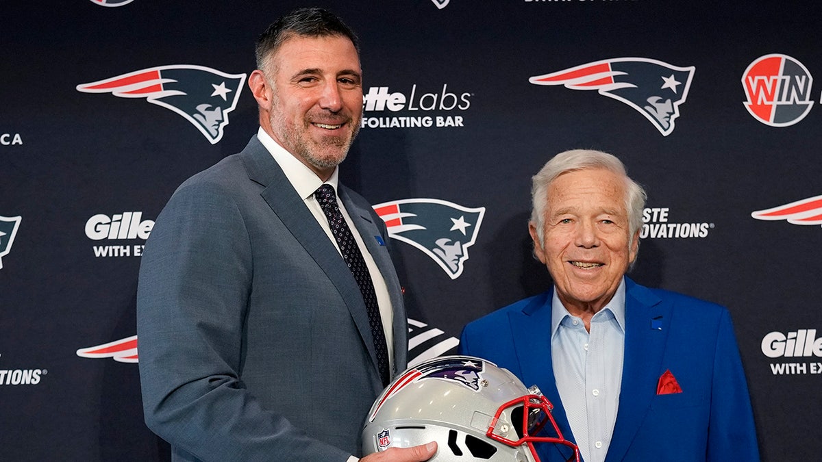 New England Patriots head coach Mike Vrabel smiling with team owner Robert Kraft in Foxborough