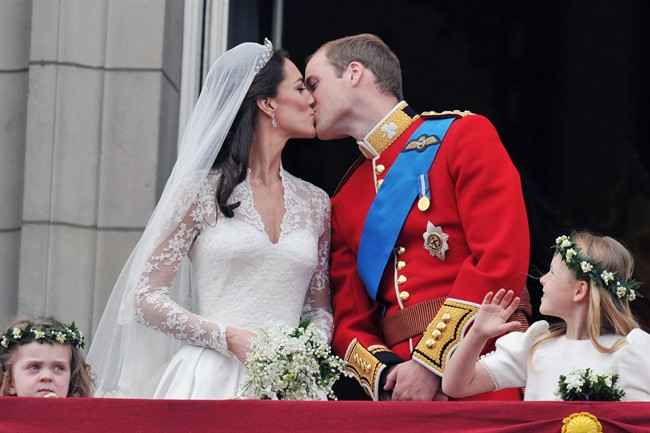 FILE- This Friday, April 29, 2011 file photo shows Prince William and his wife Kate Middleton, who has been given the title of The Duchess of Cambridge, as they kiss on the balcony of Buckingham Palace, London, following their wedding at Westminster Abbey. People love the wedding kiss, and they have definite opinions about how a couple should seal the deal.