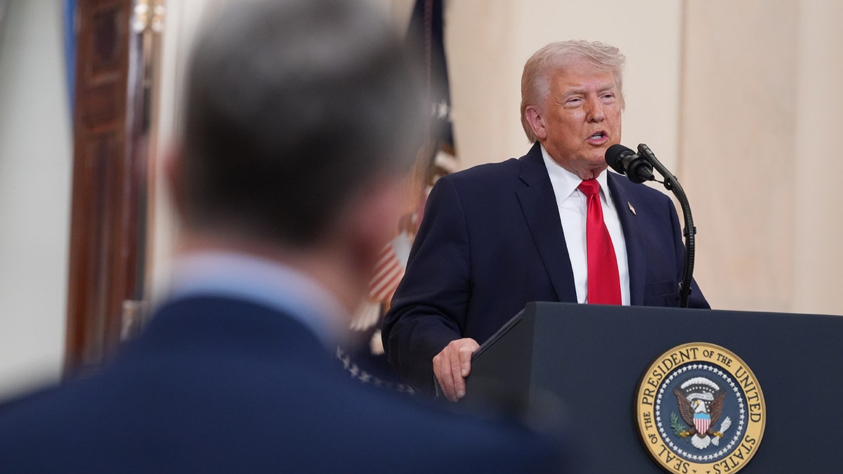 President Donald Trump speaking in the Cross Hall of the White House