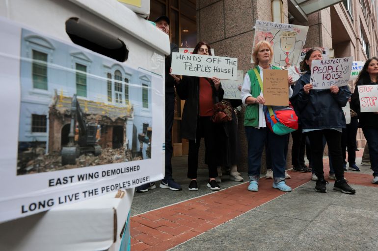 Anti-Trump activists gather before the National Capital Planning Commission meets to deliberate and vote on whether to approve the plans for the Trump White House East Wing ballroom project in Washington, D.C., U.S., April 2, 2026. REUTERS/Jonathan Ernst